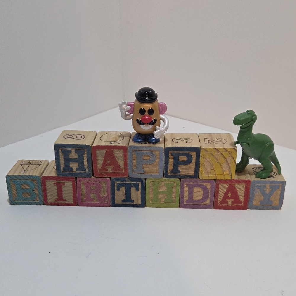 Happy Birthday alphabet blocks with T Rex and Mr. Potato Head